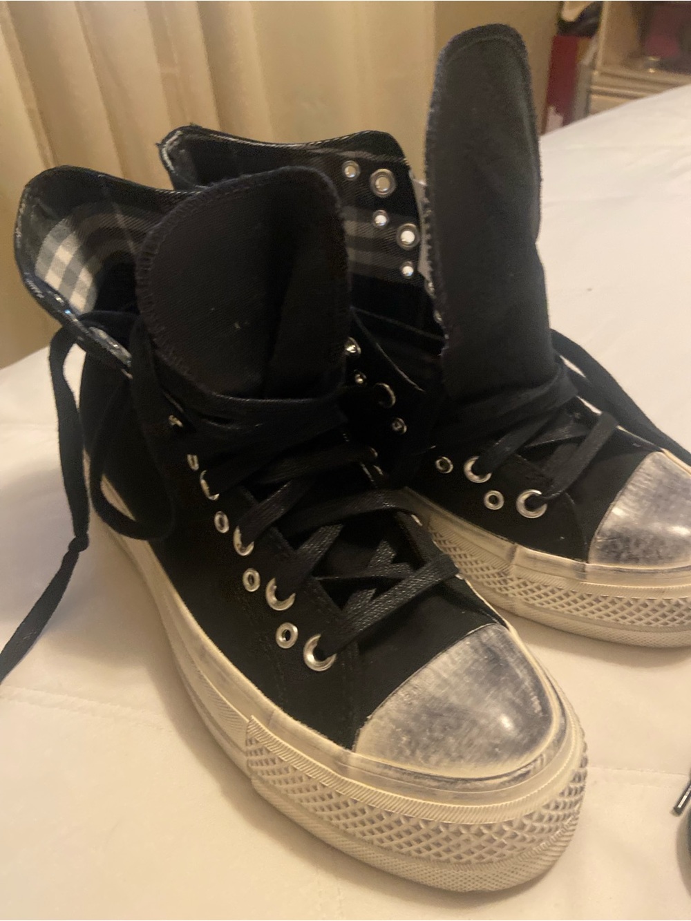 Converse Black High-Top platform with Silverish/black toe cap and jazzy eyelets.